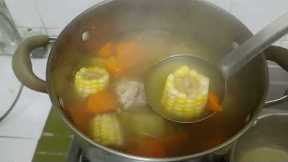simple dinner for 2, corn, carrot soup, stirfry spinach in shrimp paste, garlic prawns